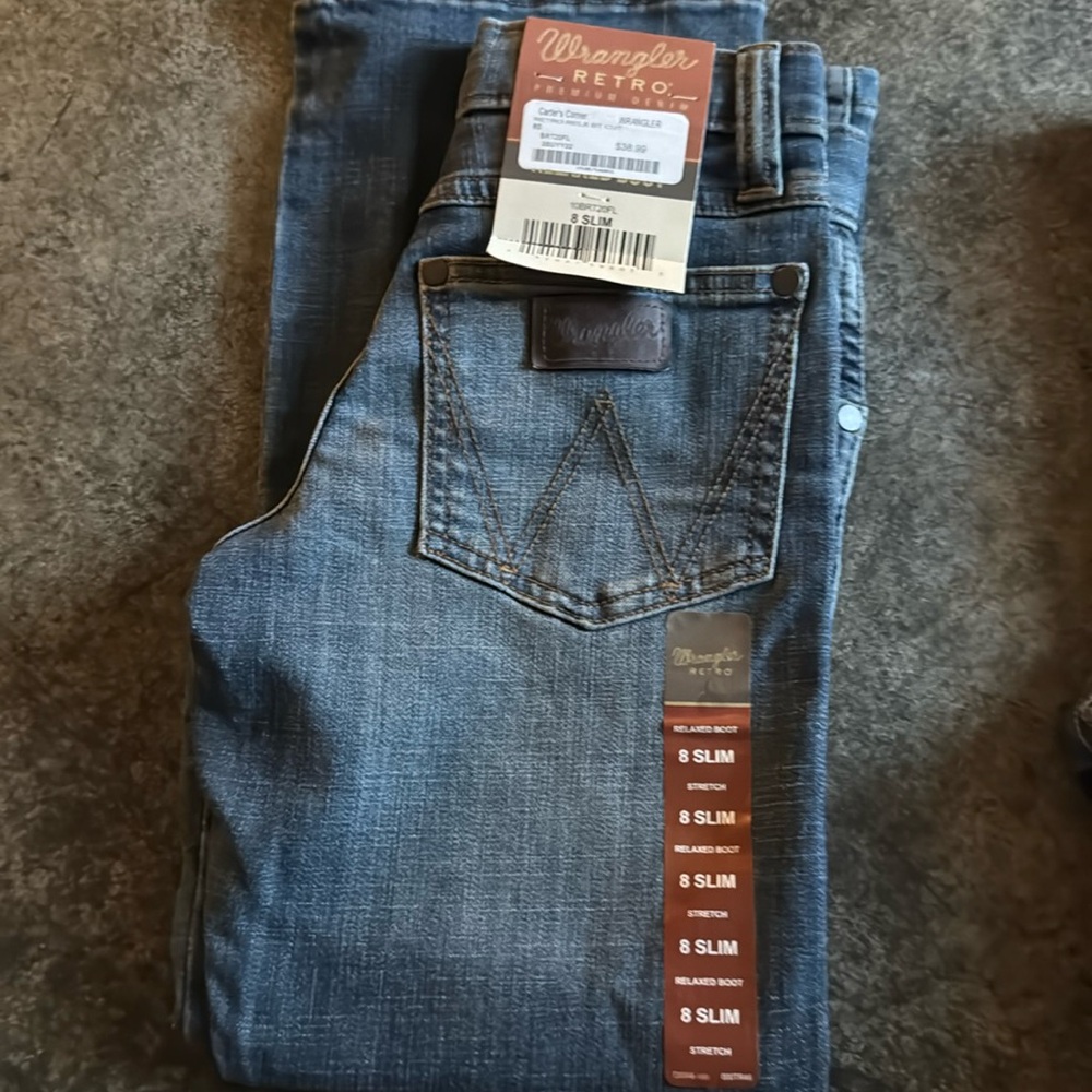 Brand new pair of size 8 wrangler. 2 new pair Levi's size 8 regular jeans boys.